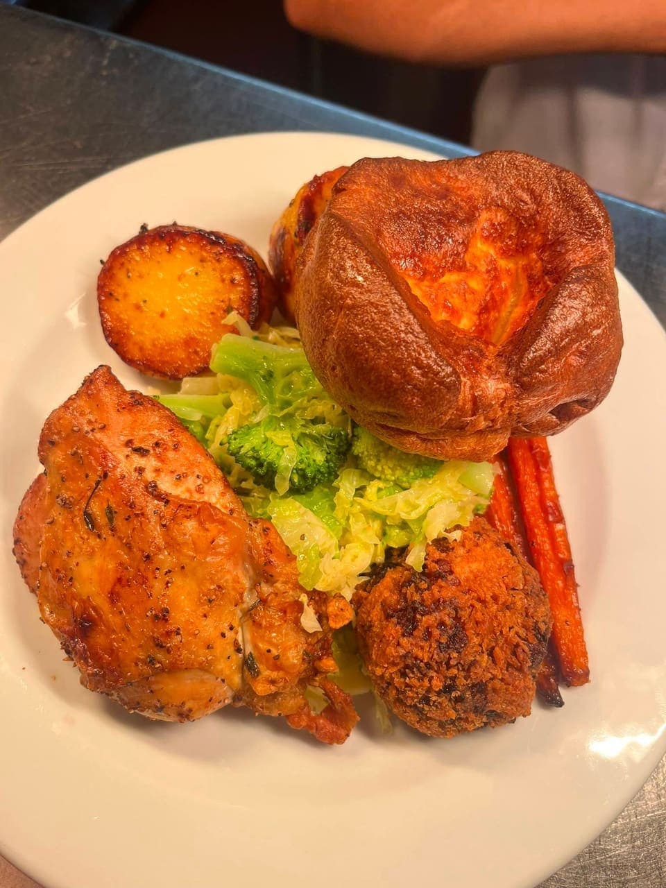 Sunday roast at The White Horse: roast chicken with a Yorkshire pudding, roast potato, carrots and greens